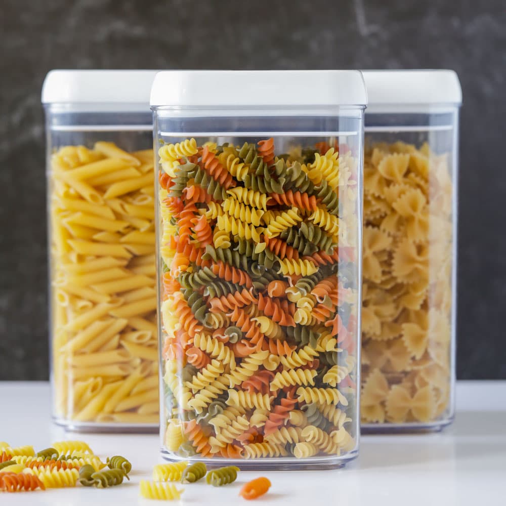 Different kinds of pastas in plastic containers.