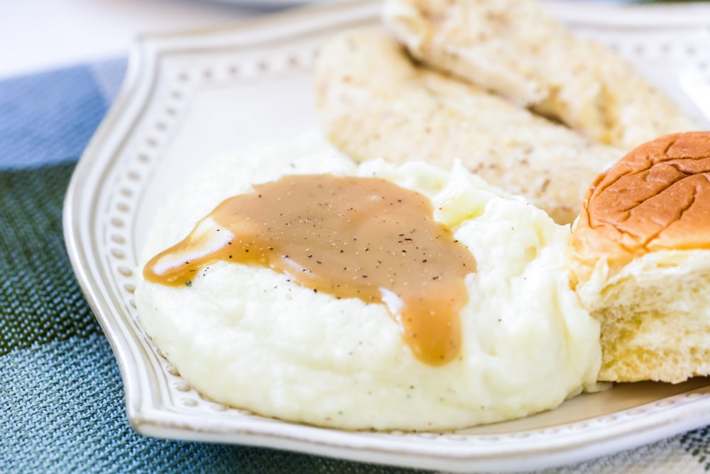 Thanksgiving side dishes - potatoes covered in mashed potato gravy.