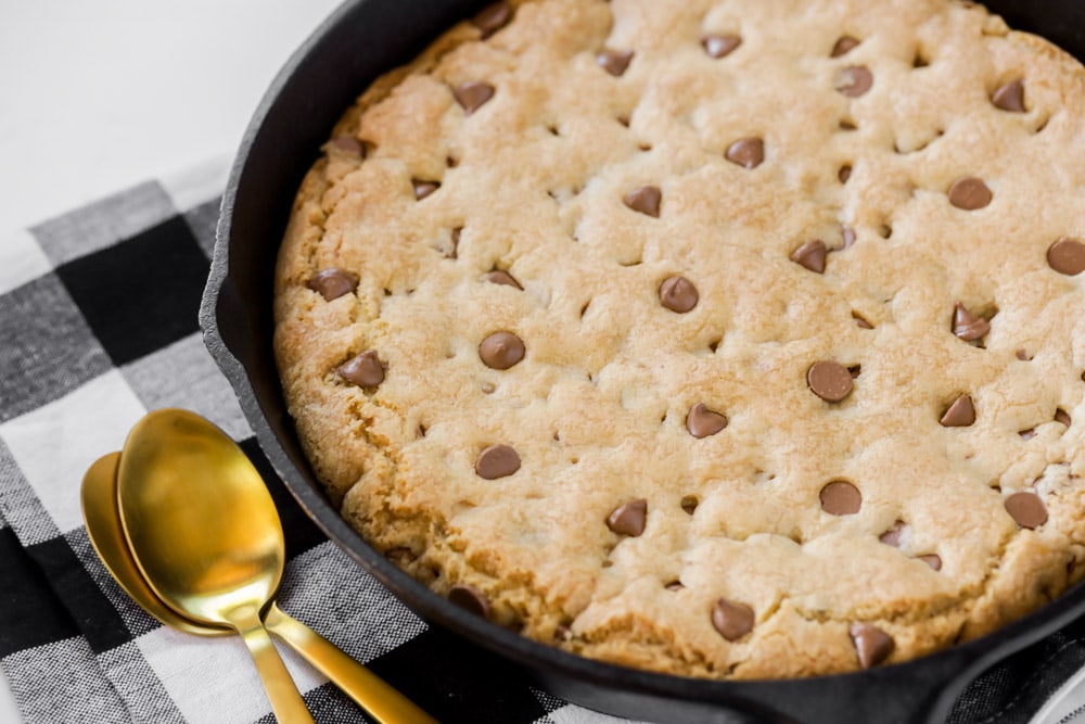 Homemade pizookie recipe cooked in an iron skillet.