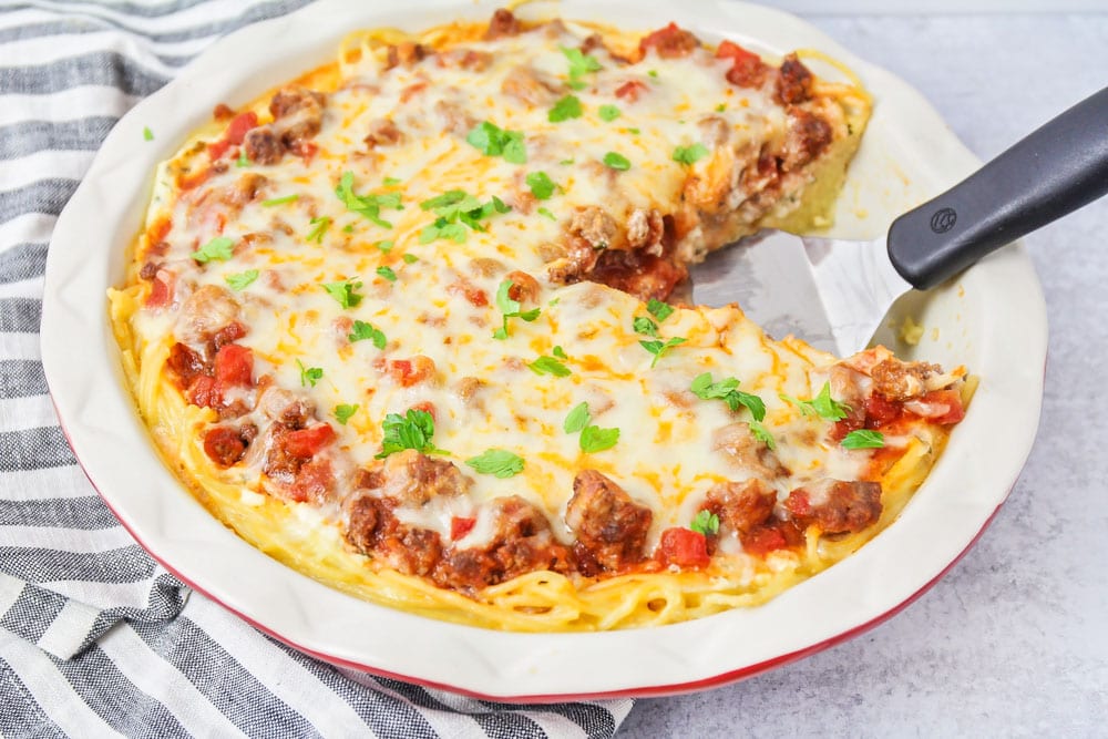 Pie dish filled with spaghetti pie.