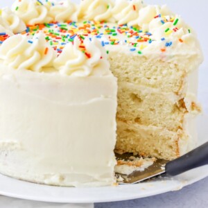 Vanilla cake with a slice missing.
