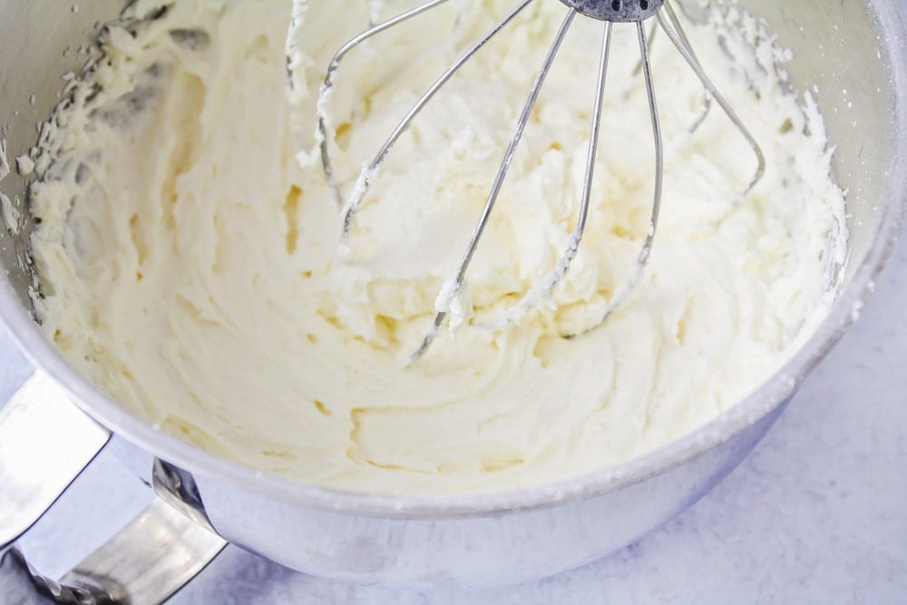 Buttercream frosting recipe being mixed in a stand mixer
