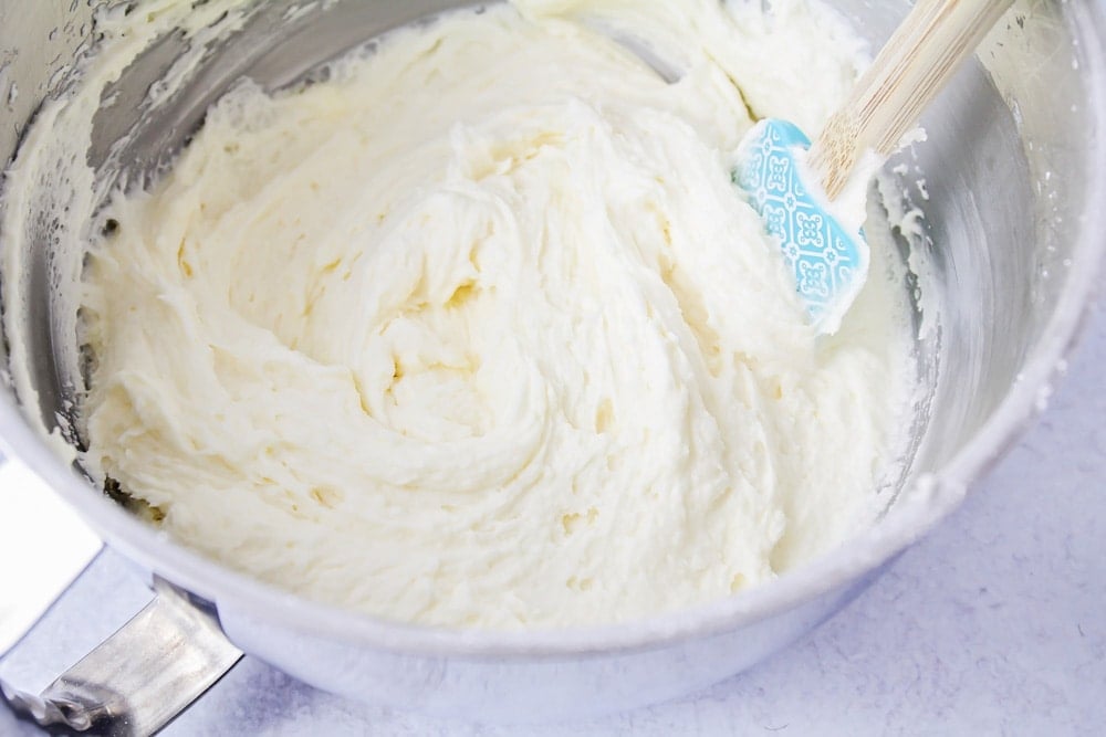 Lemon cupcakes frosting in a mixing bowl.