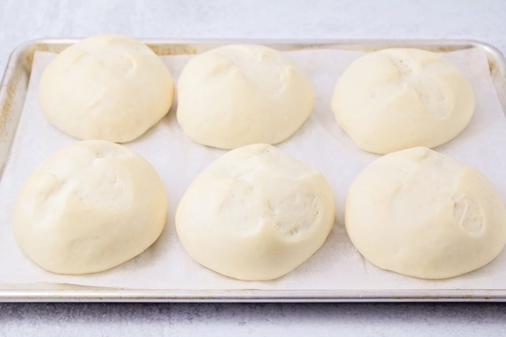 Homemade bread bowls recipe on baking sheet