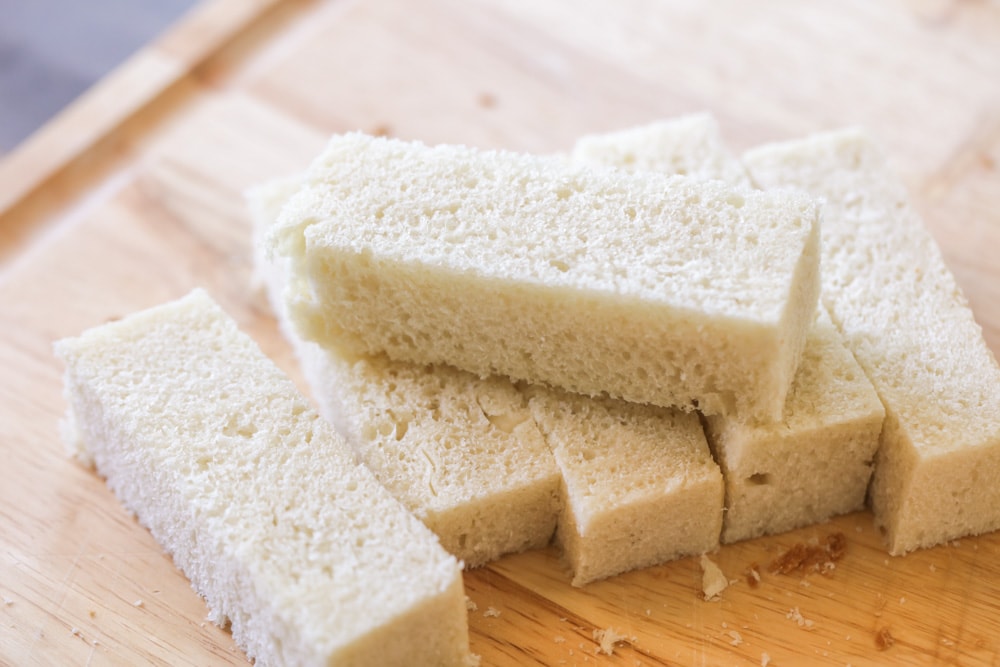 Sliced bread pieces cut into rectangles.