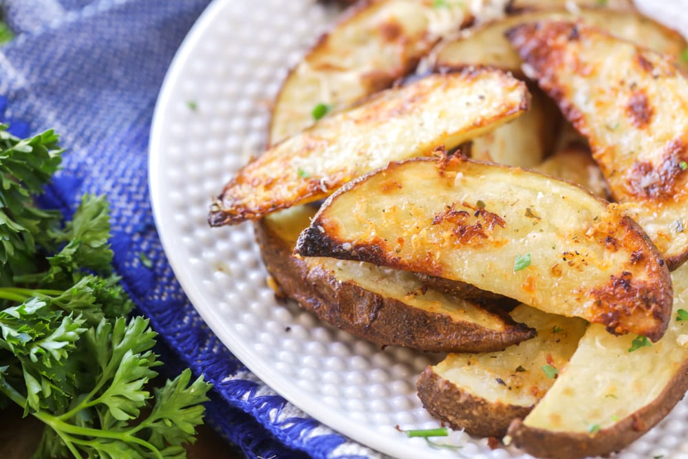 Father's Day Recipes - Potato wedges served on a white plate.