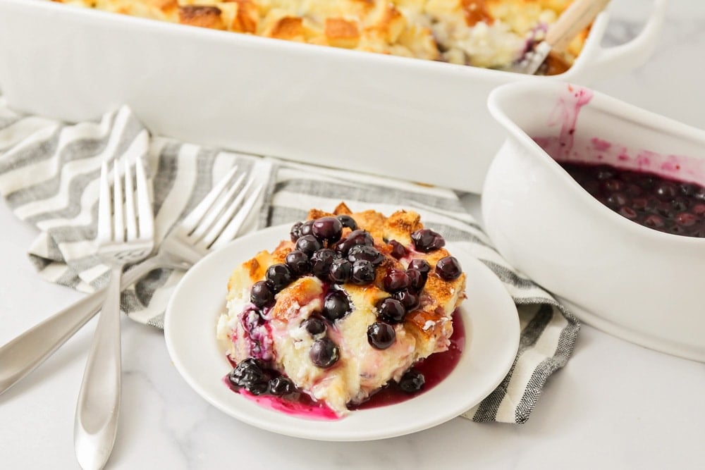 Breakfast for dinner - scoop of blueberry french toast casserole served in a bowl.