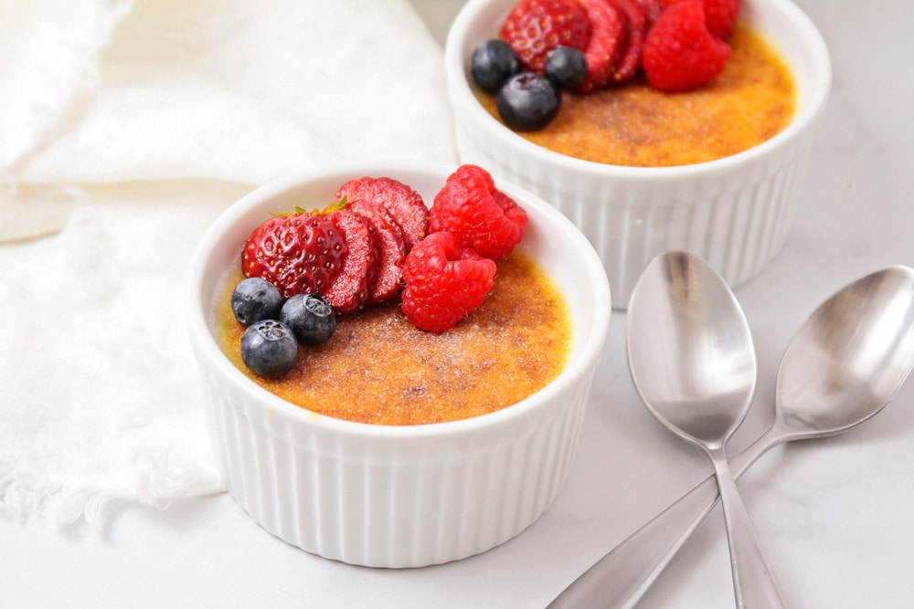 How to make creme brulee topped with fresh berries.