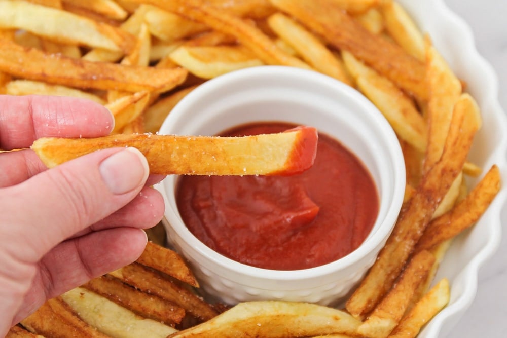 French fries recipe - dipped in ketchup