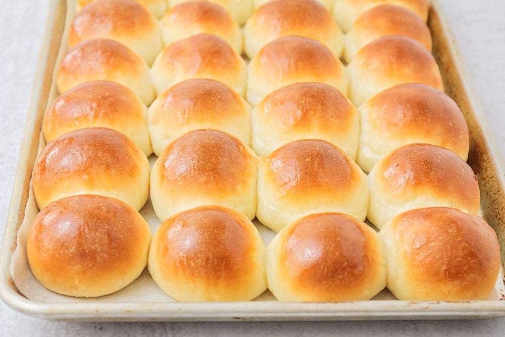 Thanksgiving side dishes - a pan full of potato rolls.