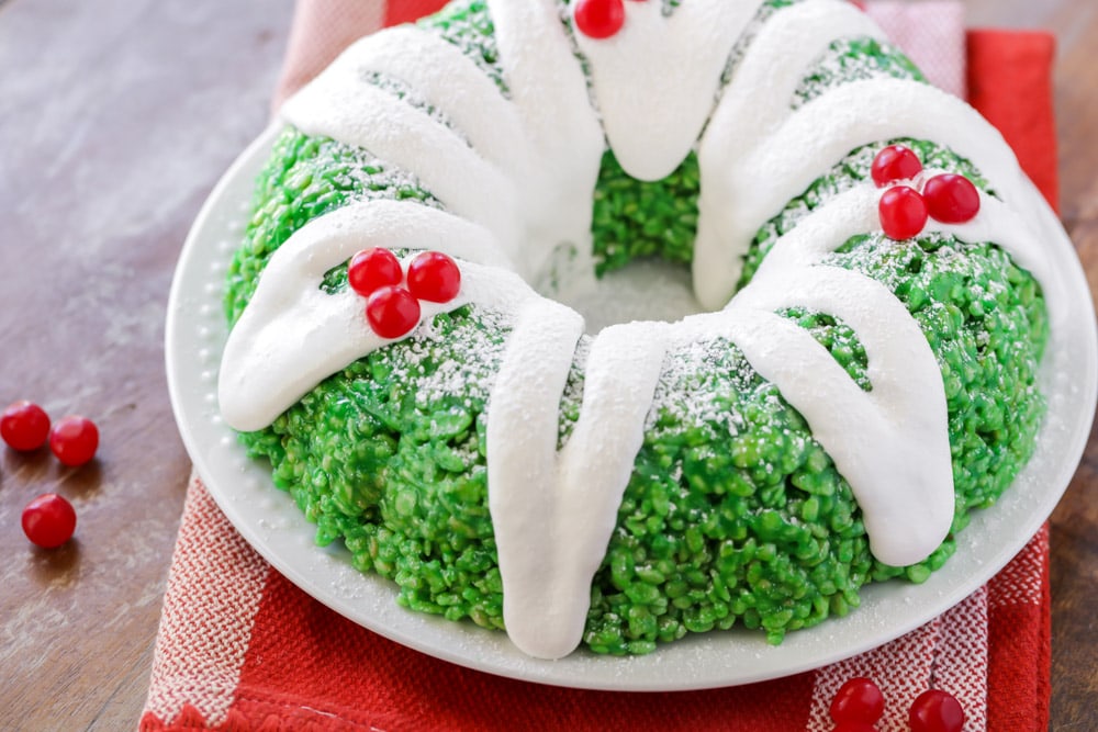 Christmas desserts - a green rice krispie wreath topped with red candies.