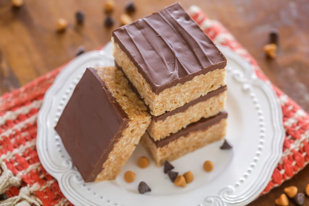 Thanksgiving desserts - square scotheroos stacked on a white plate.