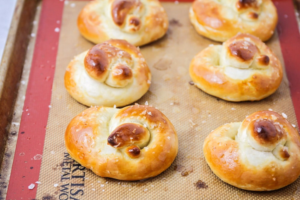 Soft pretzels on baking sheet