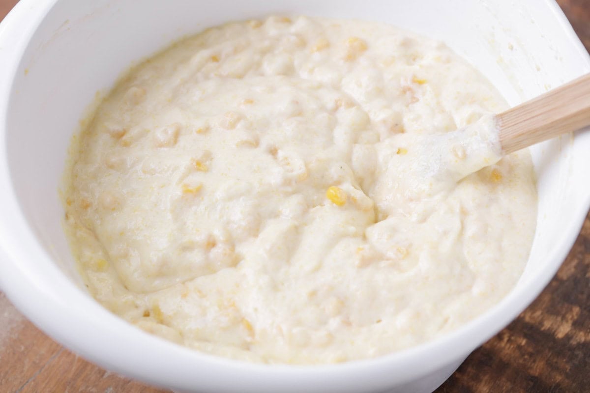 Cornbread batter in a white bowl.