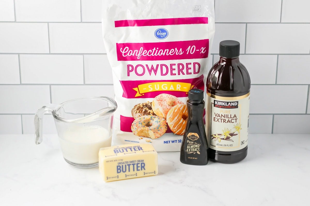 Sugar cookie frosting recipe ingredients on countertop.