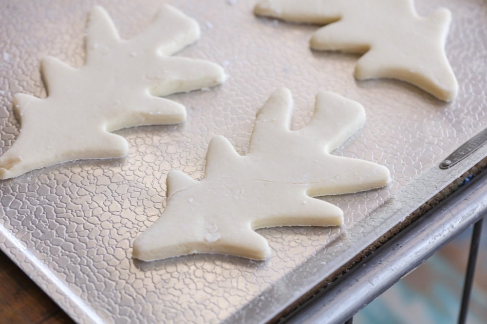 Christmas Tree sugar cookies on a baking sheet