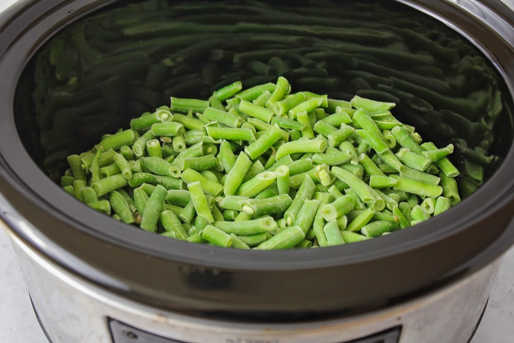 Frozen green beans in the slow cooker for crockpot green bean casserole.