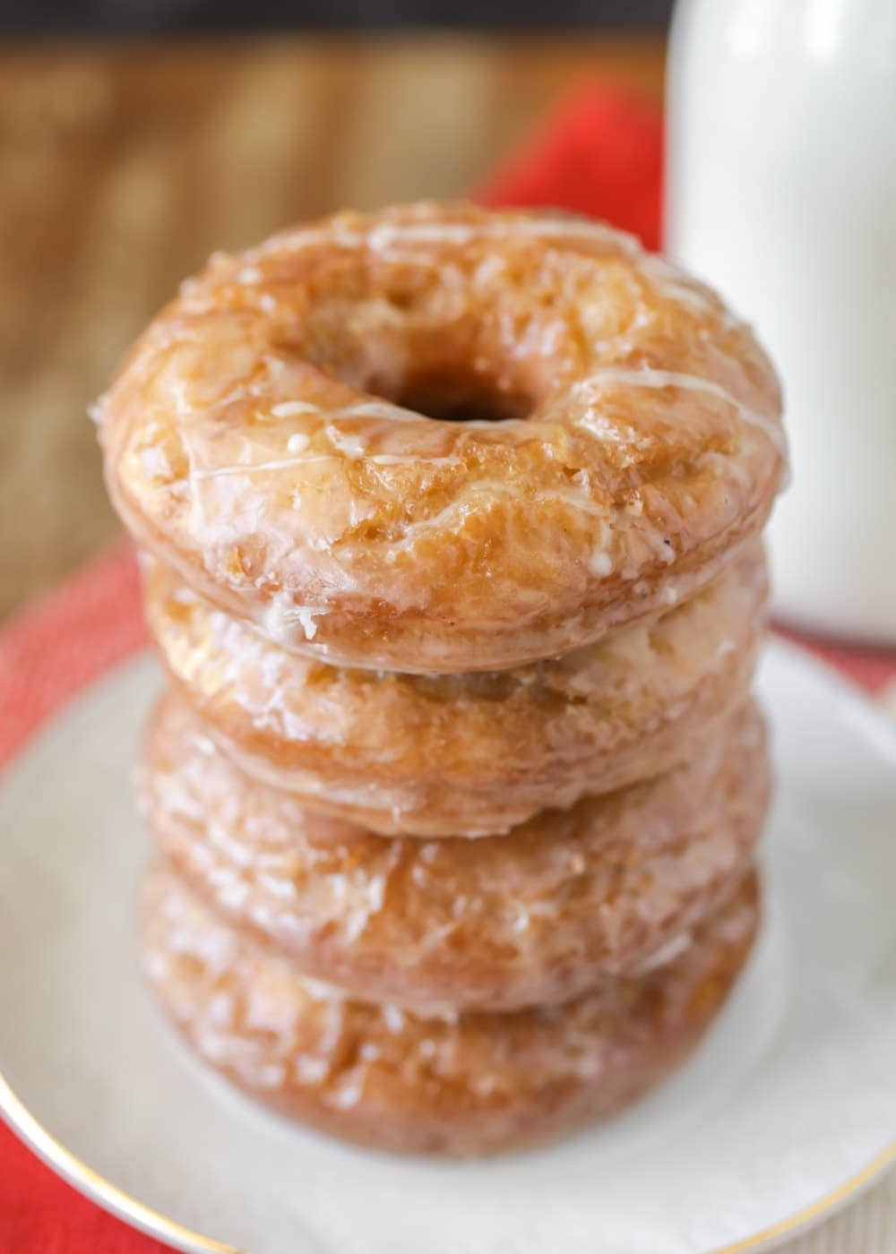 A stack of old fashioned buttermilk donuts on a white plate