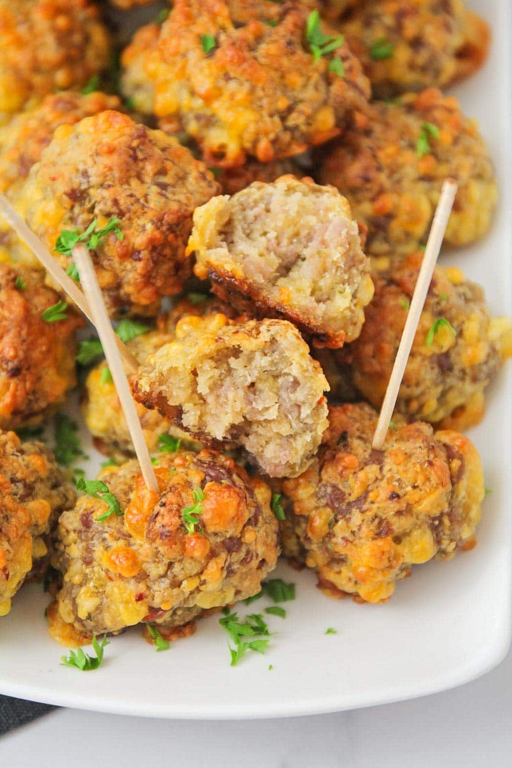 Close up of bisquick sausage cheese balls on toothpicks