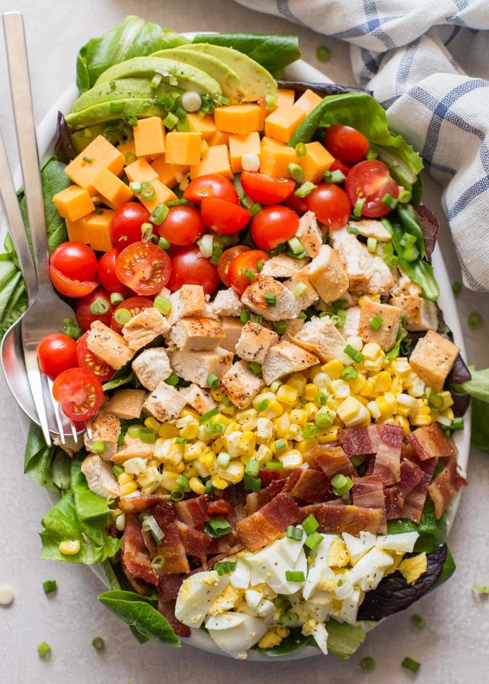 Cobb salad recipe assembled in a large salad bowl.