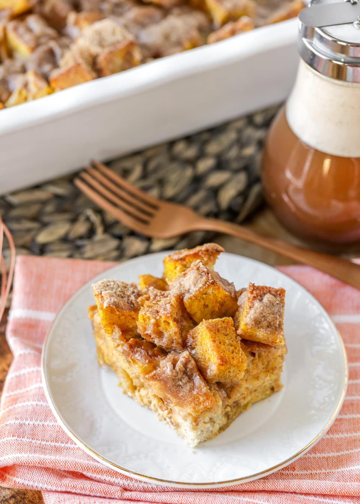 Pumpkin french toast casserole slice on a white plate