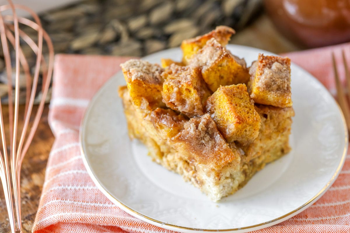 Thanksgiving breakfast ideas - a serving of pumpkin french toast bake served on a white plate.