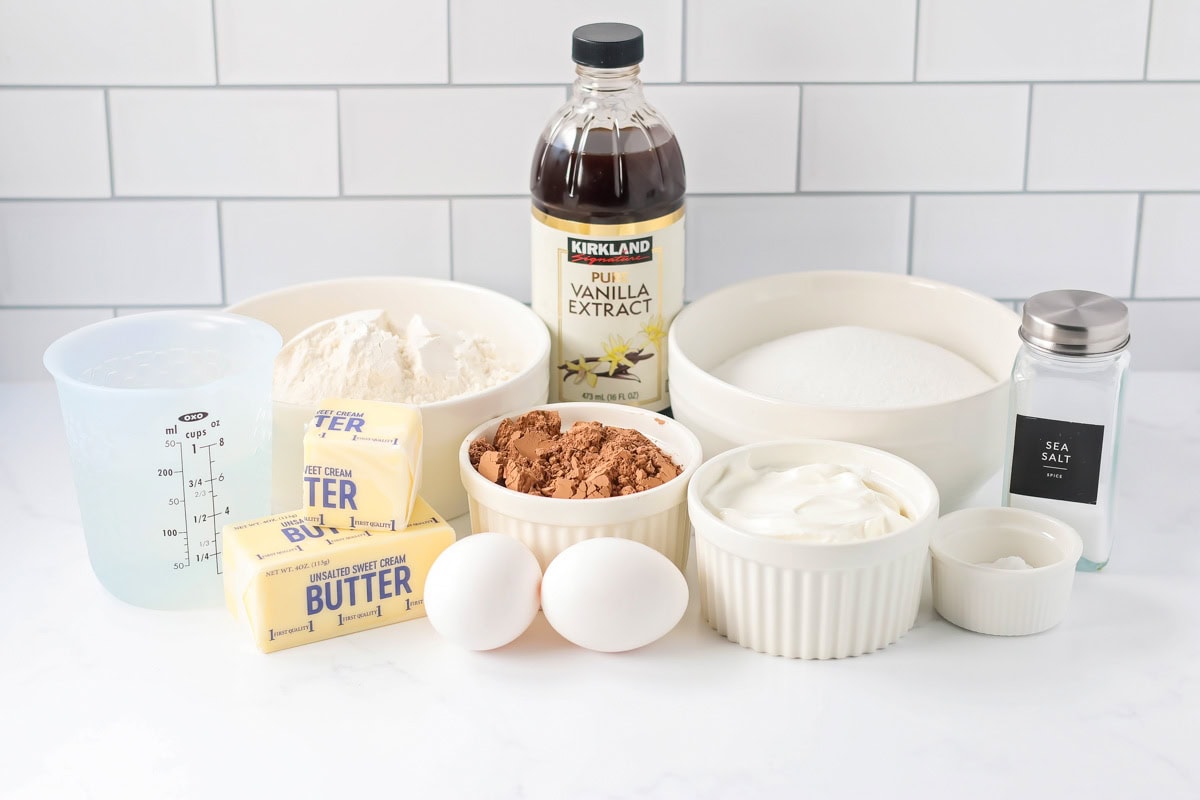 Sour cream chocolate cake ingredients on counter.