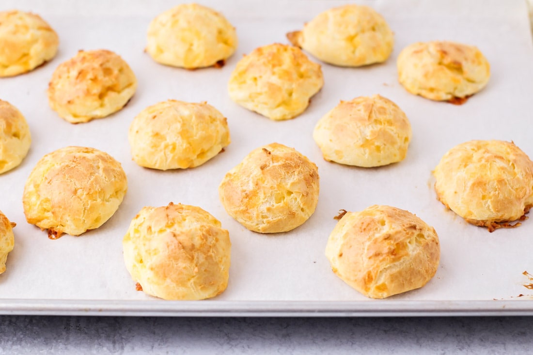 Baked French cheese puffs on a sheet pan