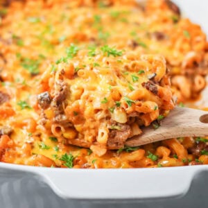Hamburger casserole recipe with cheese on top and baked in baking dish.