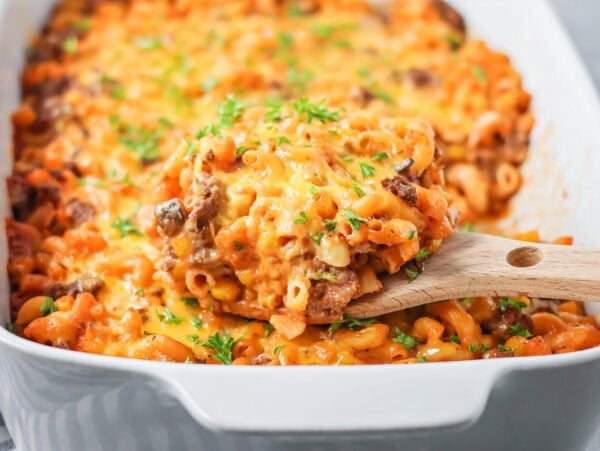 Hamburger casserole recipe with cheese on top and baked in baking dish.