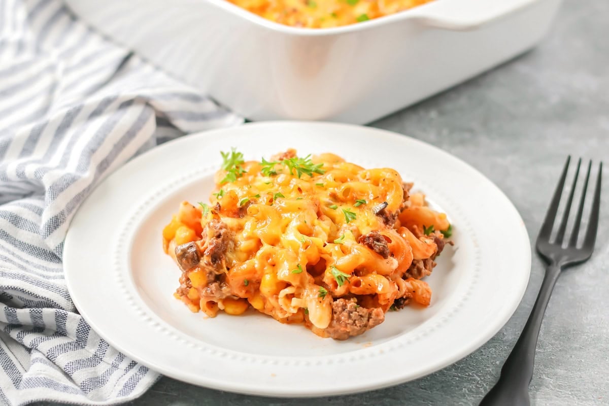 Easy hamburger casserole recipe dished out on white plate.