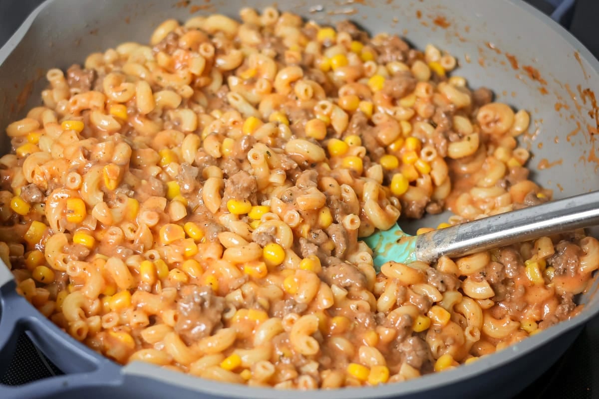 Macaroni and hamburger mixed together in skillet for Hamburger casserole recipe.