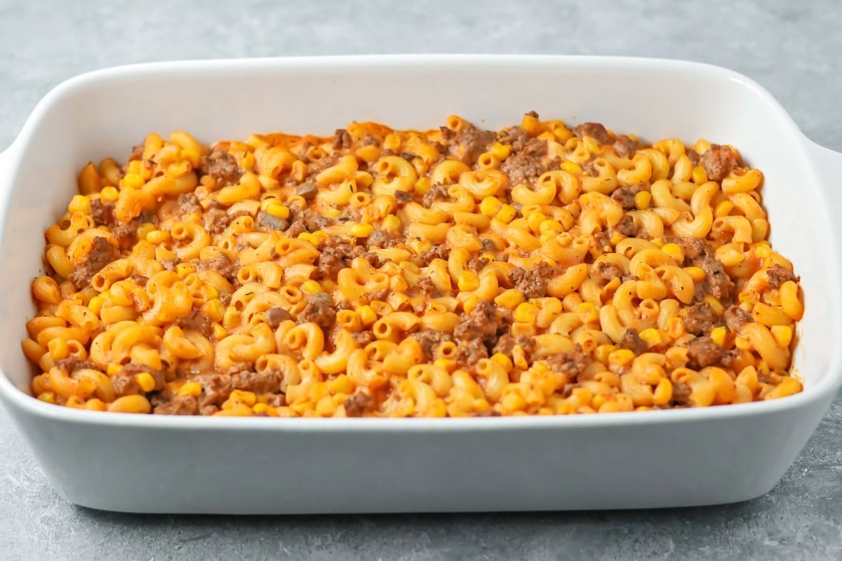 Hamburger casserole poured into baking dish ready to bake.