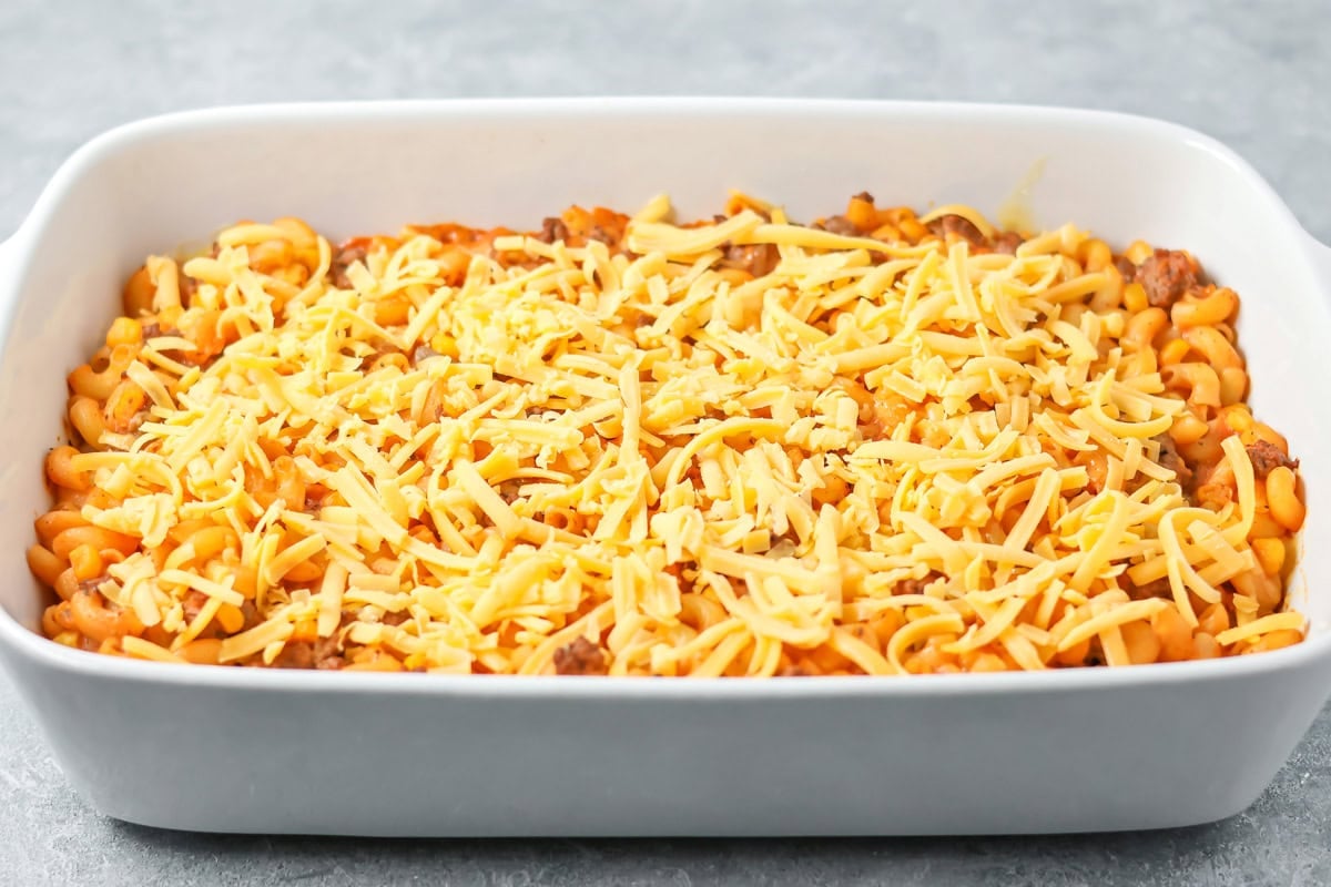 Shredded cheese poured over hamburger casserole recipe.