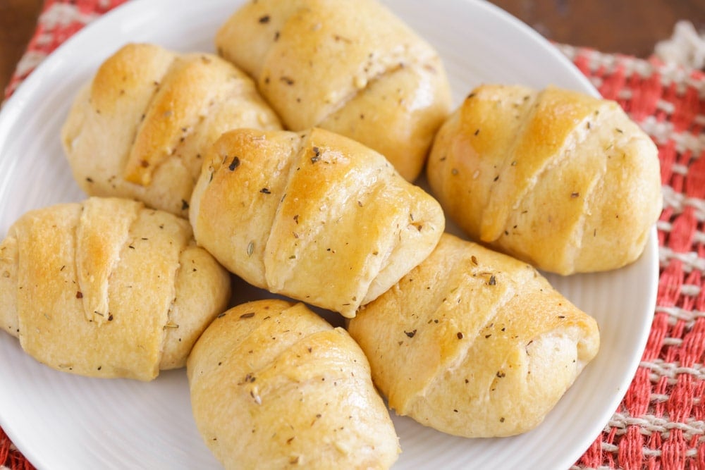 Pizza Roll Ups piled onto a plate.