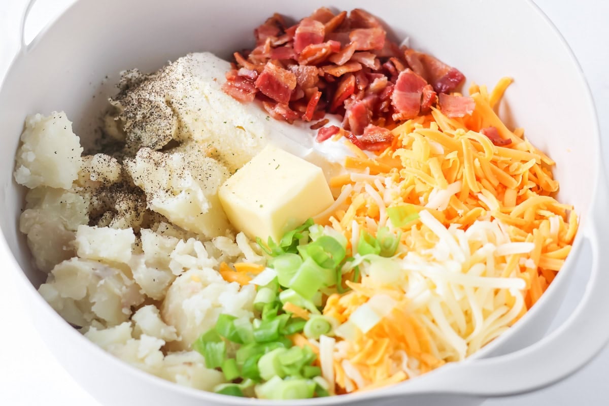 Ingredients for twice baked potato casserole in a bowl.