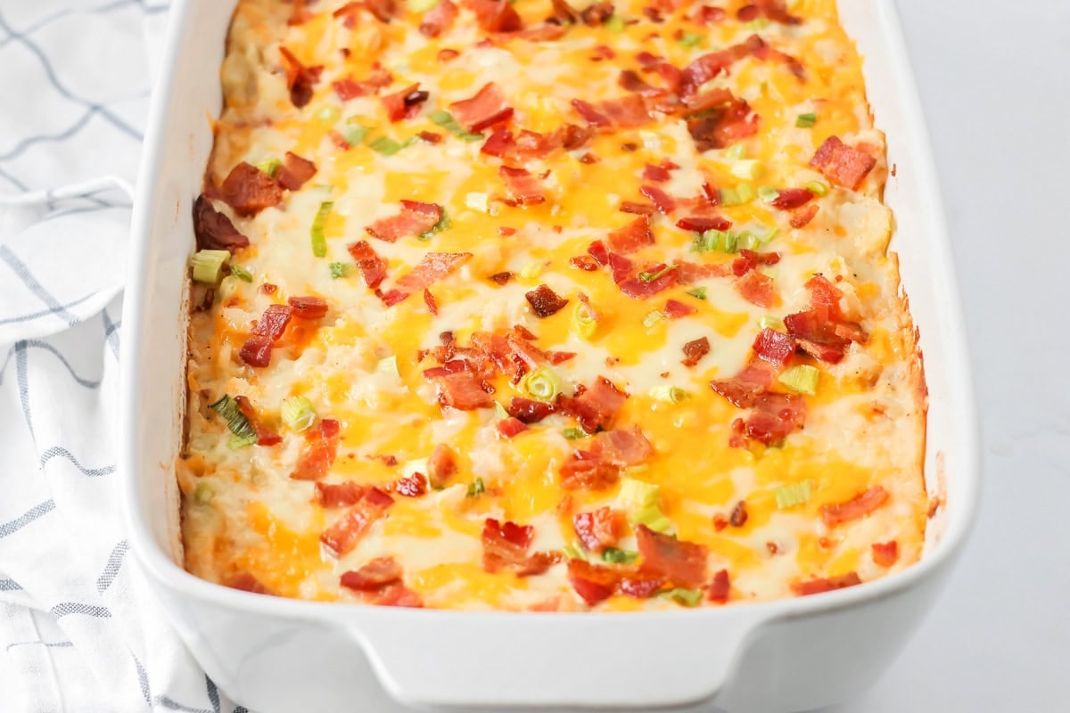 A baked twice baked potato casserole topped with bacon.