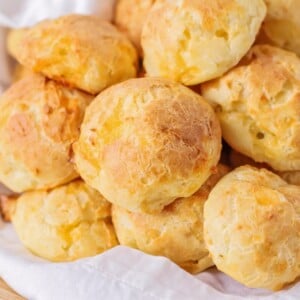 A bowl of cheese puffs.