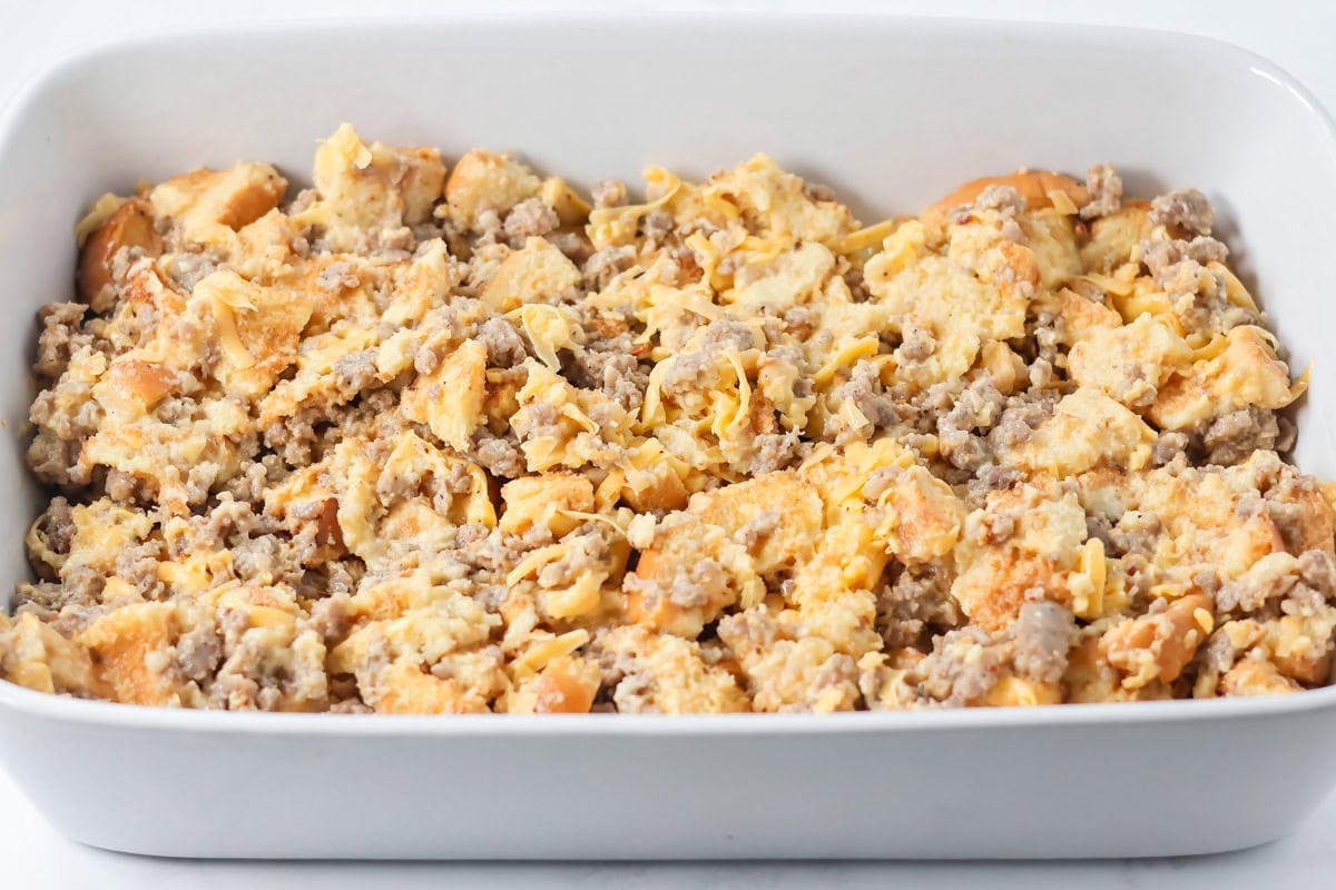 A baking dish of Christmas breakfast casserole ready to be baked.