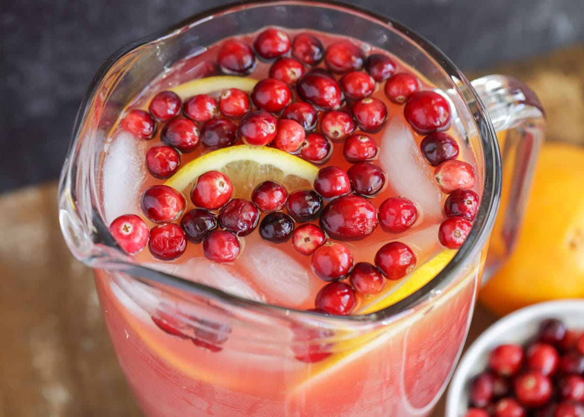 Close up of cranberry holiday punch in pitcher.