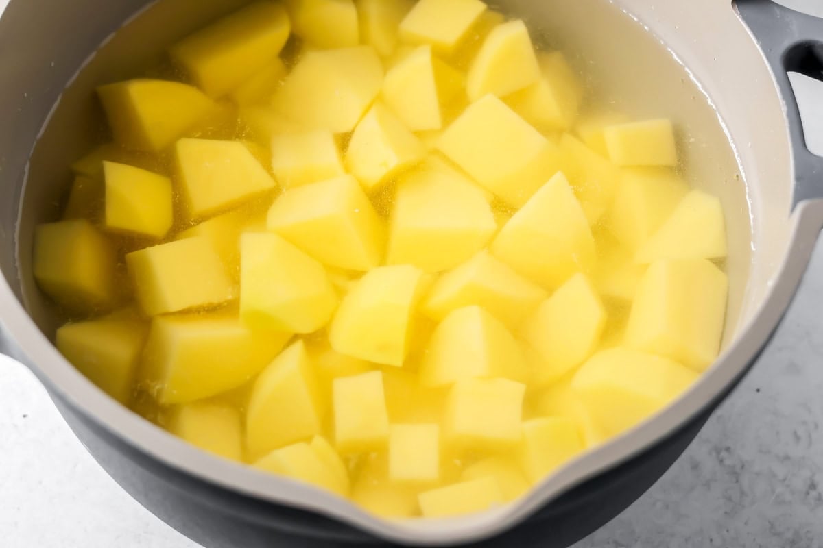 Potatoes boiling for making thanksgiving leftover casserole.