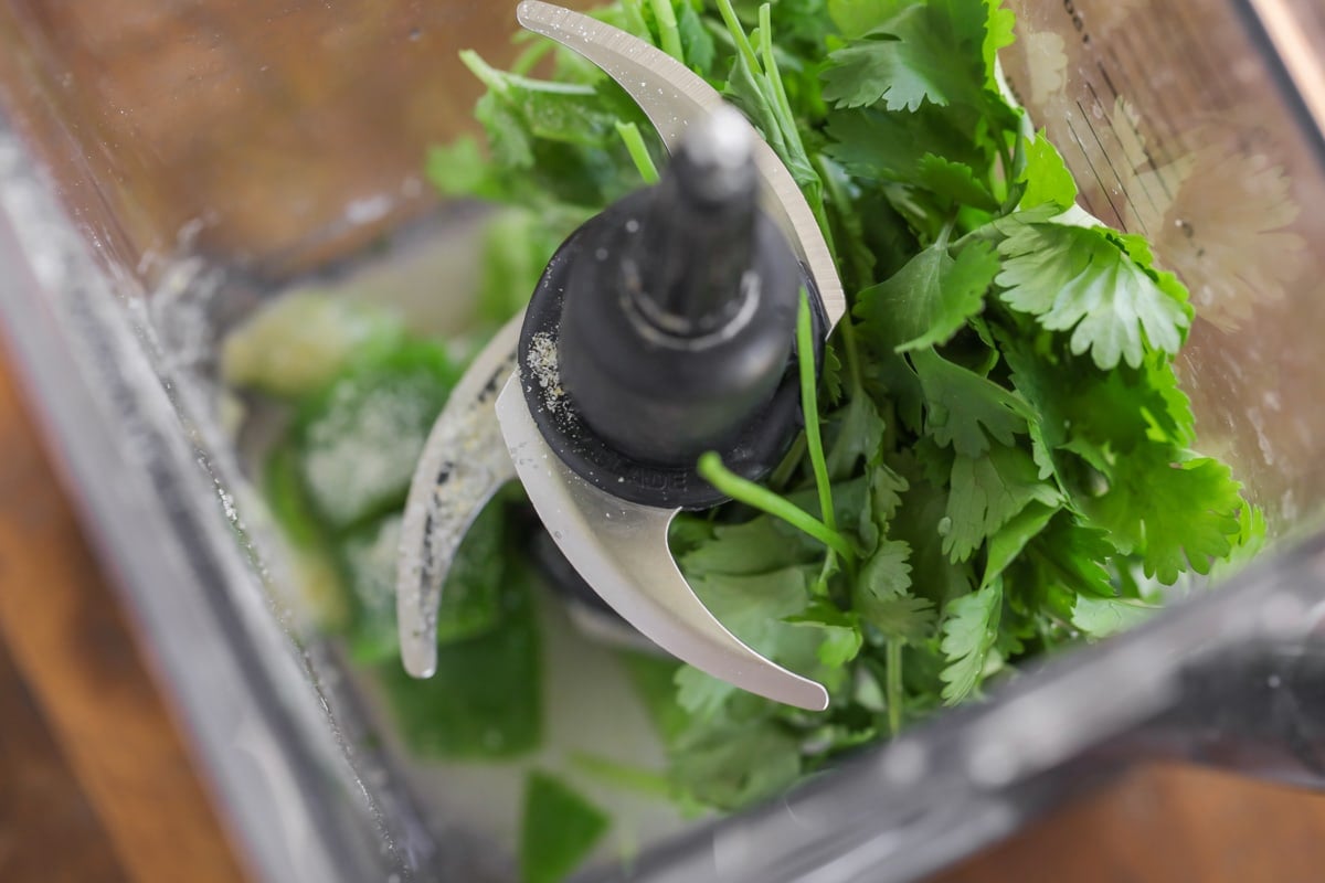 Blending ingredients for cilantro lime vinaigrette dressing