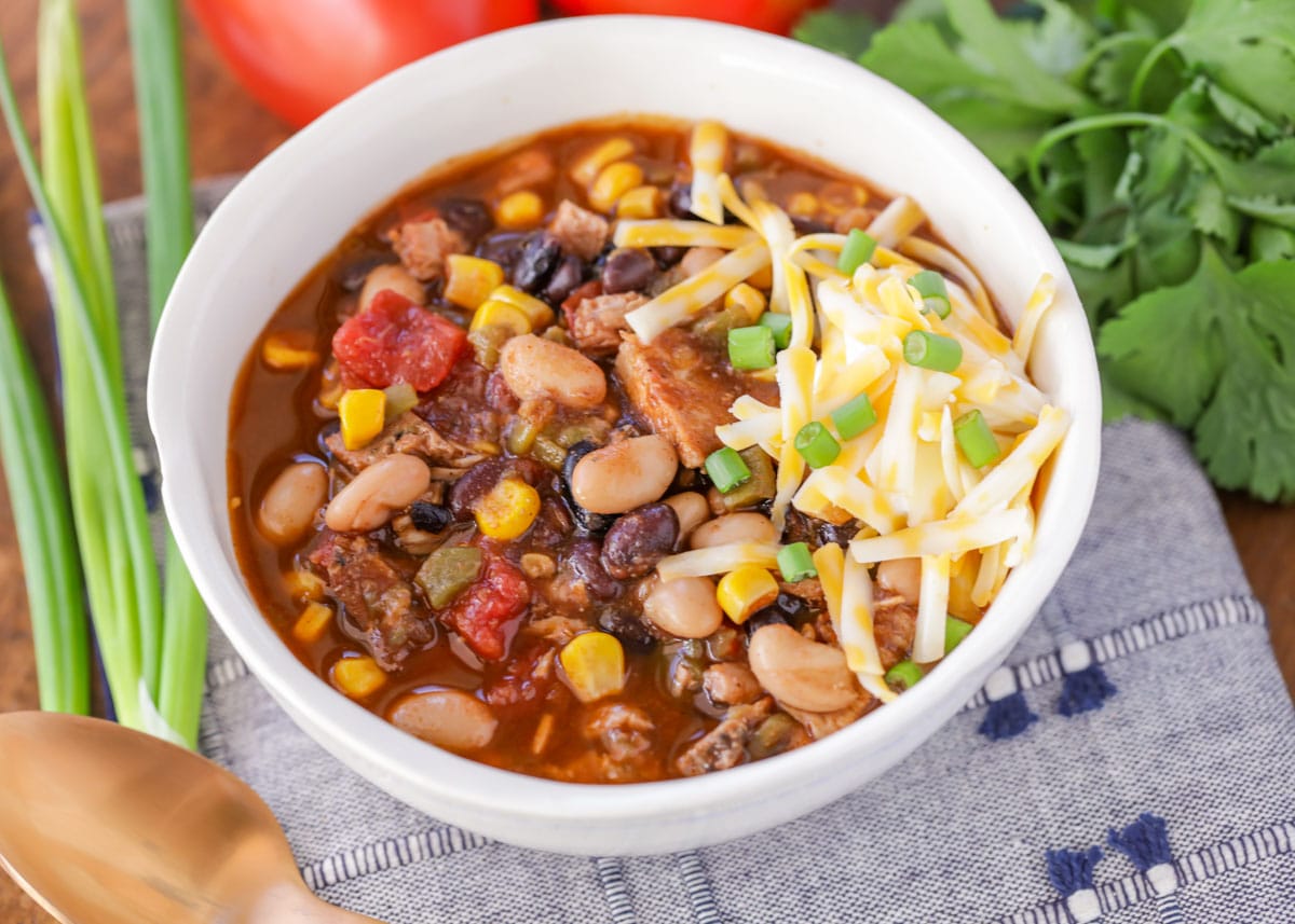 Crockpot turkey chili served in a white bowl. 