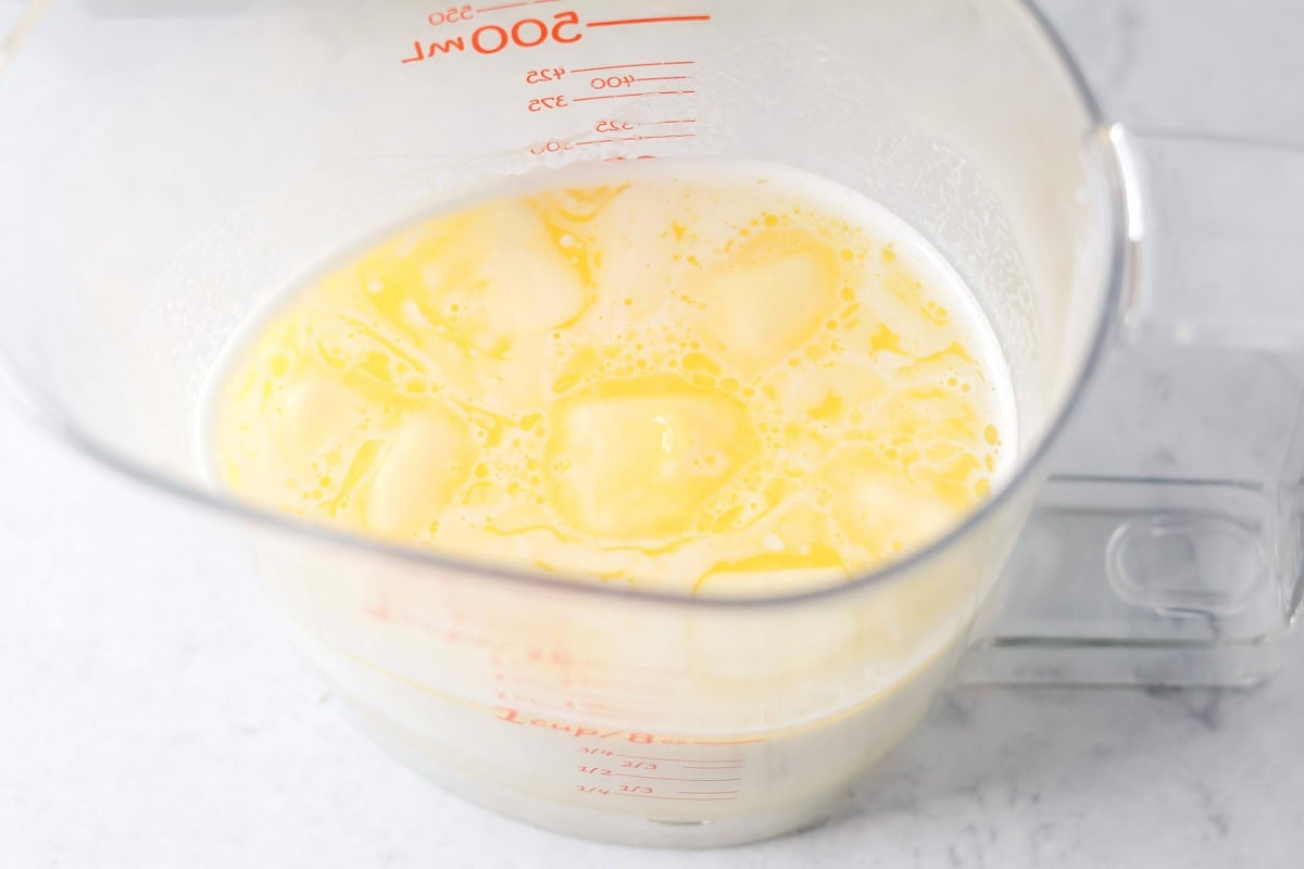 Butter and milk mixture for making mini cinnamon rolls.