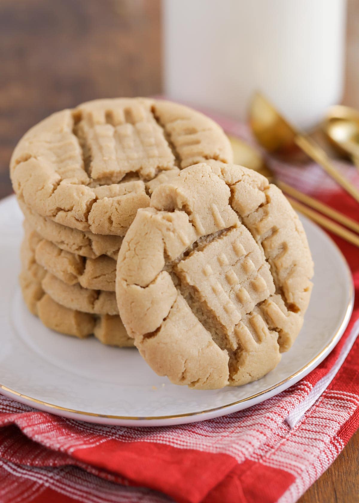 Best peanut butter cookies stacked high on a white plate