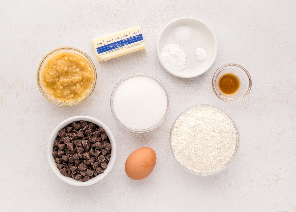 Ingredients for banana chocolate chip cookies on a kitchen counter.