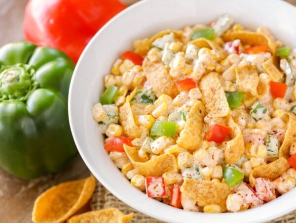 Frito Corn Salad recipe mixed together in white bowl.