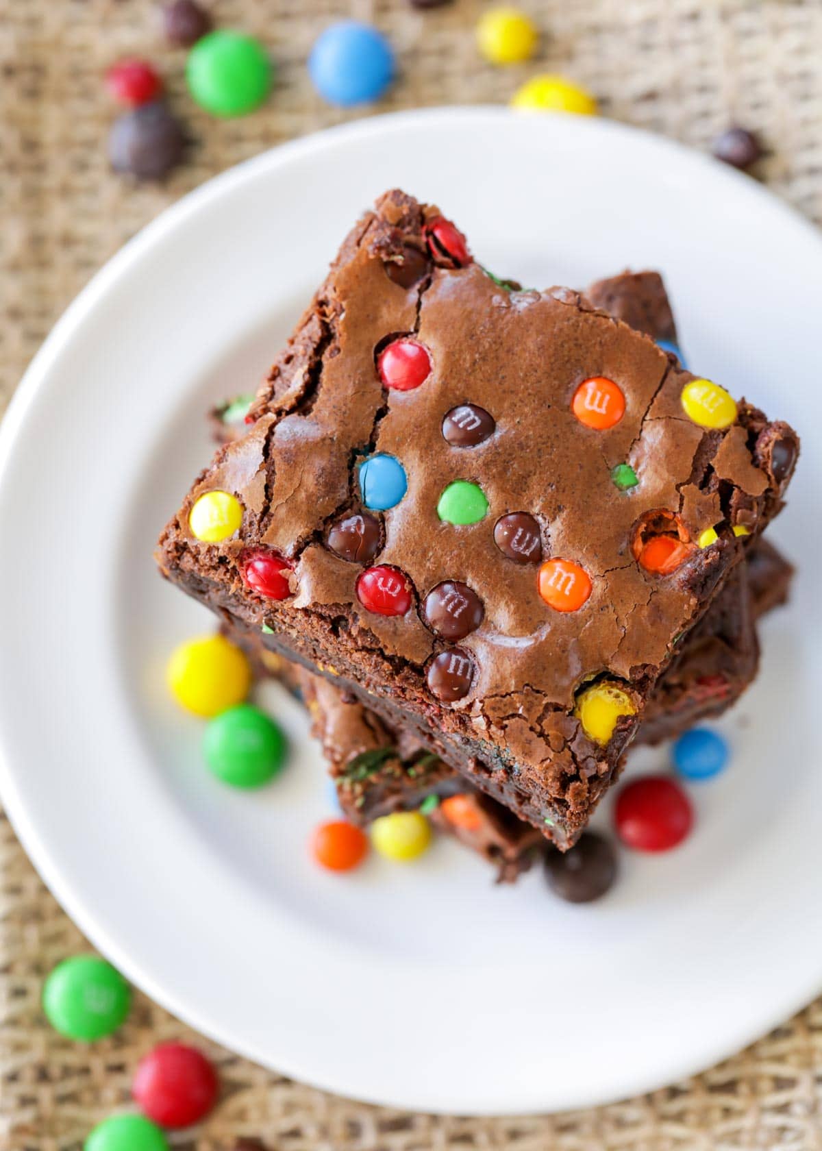 M&M brownies recipe stacked on a white plate