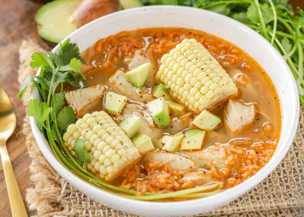 A bowl filled with caldo de pollo soup.