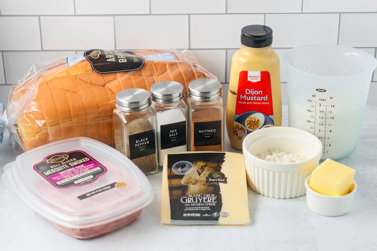 Croque Monsieur sandwich ingredients on counter.
